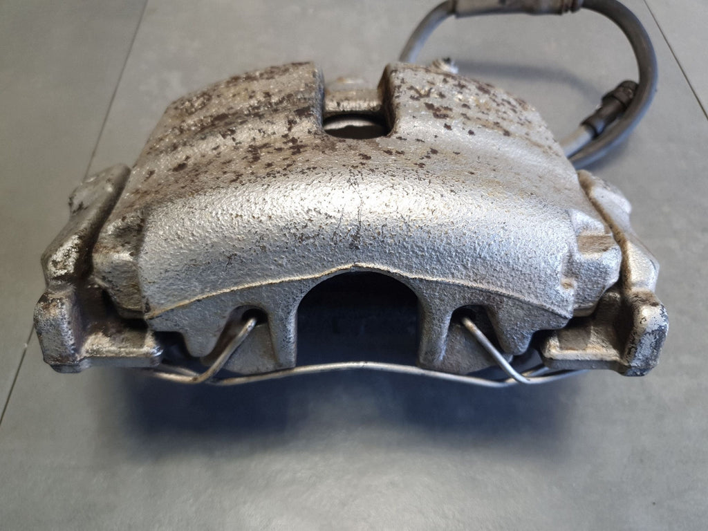 Volkswagen PASSAT CC Brake caliper left front yoke 1K0615123E